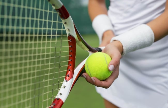 image of a tennis player holding a tennis ball