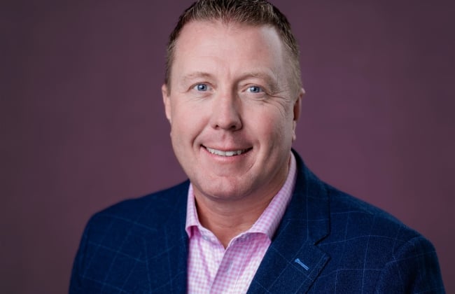 A headshot of Sean Sachs